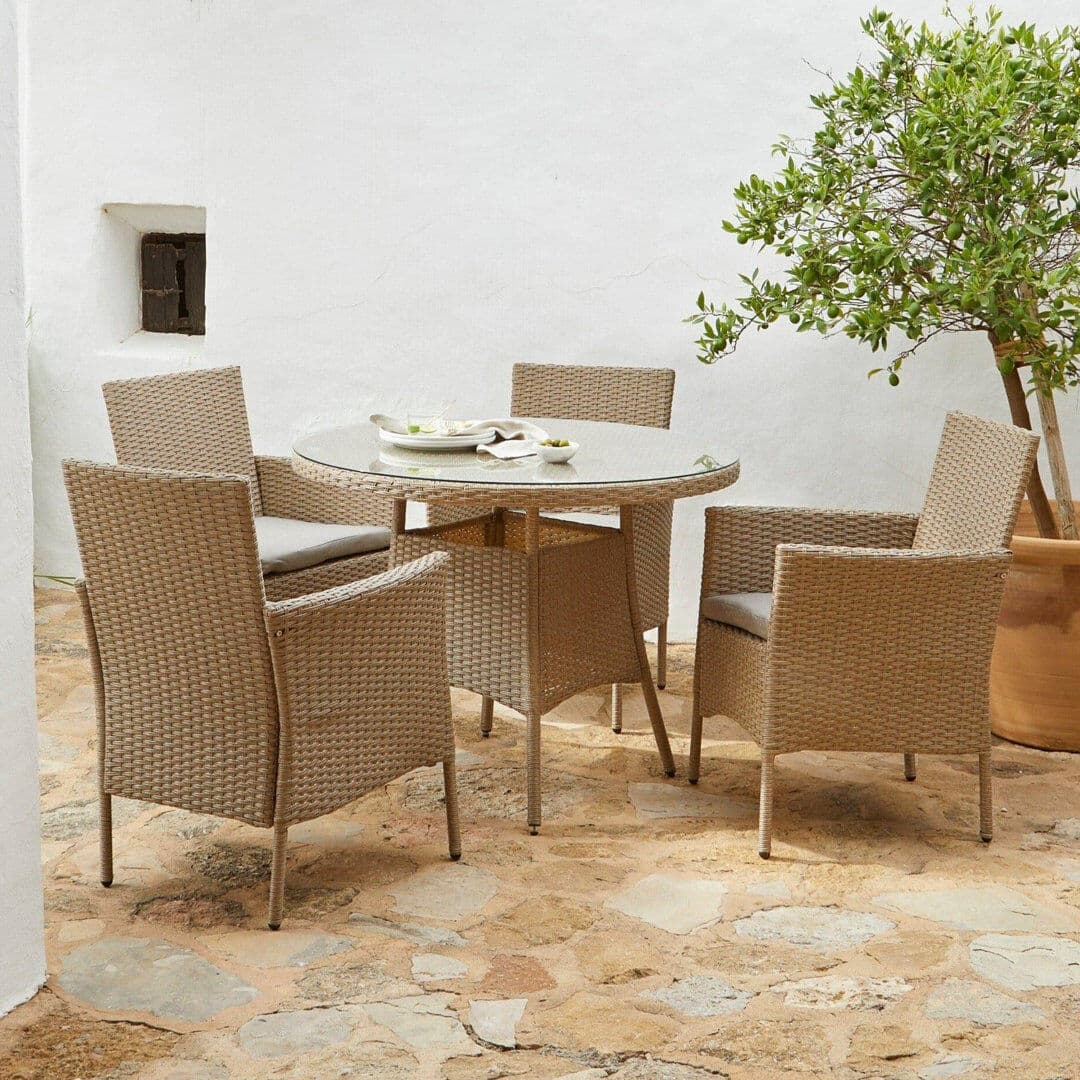 Lark Manor Dubose 4 - Person Wicker Patio Dining Set with Round Table , Cushions Included Brown 4