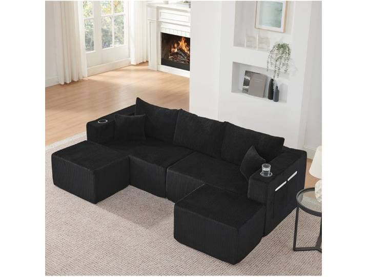 Canapé d'angle modulable 3 places noir en velours côtelé 2 poufs mobiles porte-gobelets et rangements